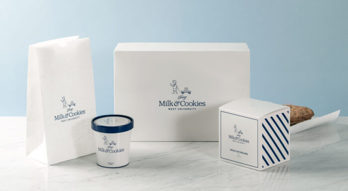 Tinys milk and cookies to-go packaging suite featuring to go bags and cartons.