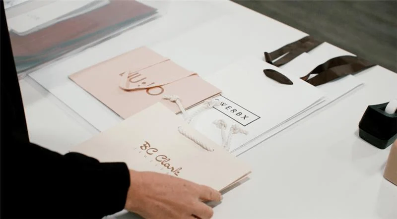 Custom packaging samples on display showing luxury retail bag design and strategic brand alignment.