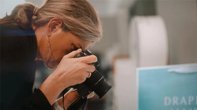 Packaging expert capturing branded product detail during packaging development and design review.