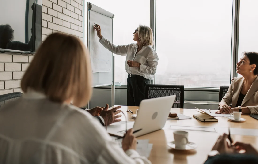 A team meets to plan operational changes, reflecting retailer preparation for California’s Plastic Bag Ban.