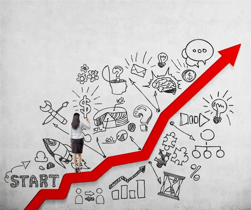 A woman climbing a bold red arrow drawn on a wall covered in hand-sketched business icons, representing the path from startup to strategic growth for e-commerce brands.