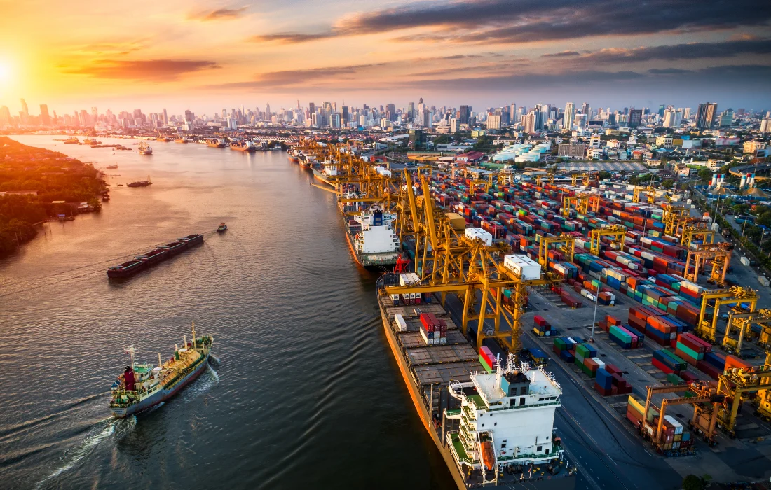 Shipping port with cargo containers and cranes, highlighting global trade and packaging