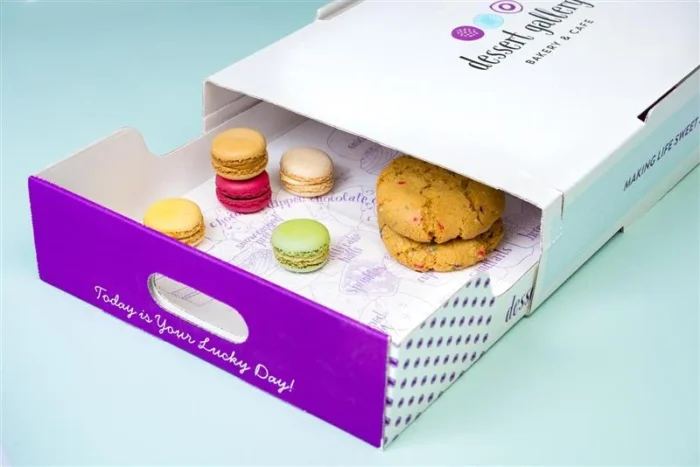 Dessert Gallery bakery box with macarons and cookies inside, purple branded design with “Lucky Day” text.