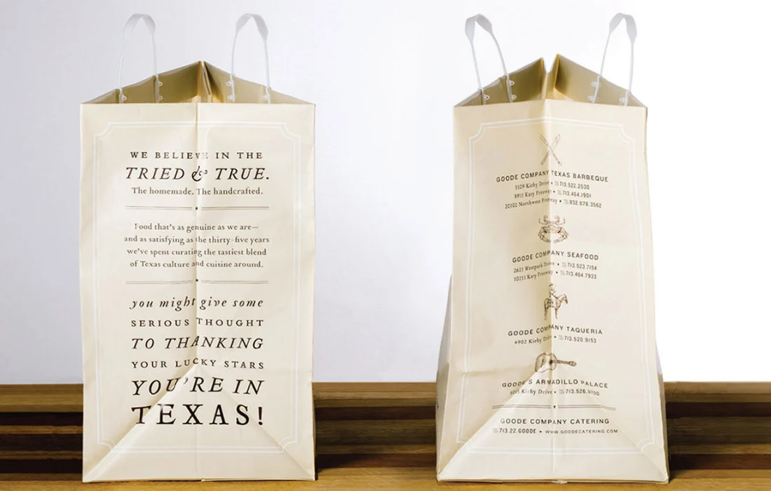 Cream paper takeout bags with printed restaurant branding and addresses, showcasing a sustainable packaging strategy.