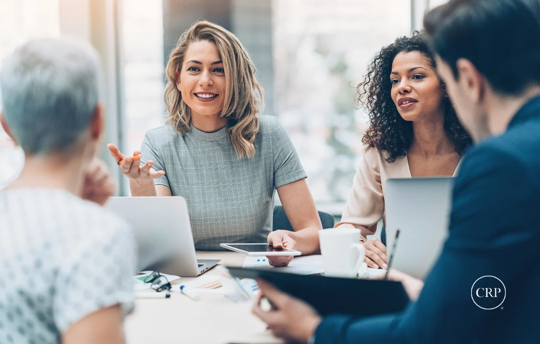 Female business leaders discussing packaging supplier strategy in a meeting.