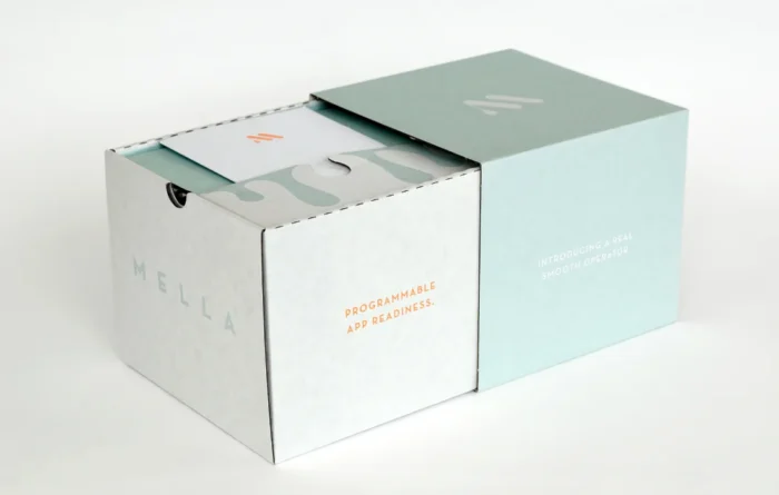 "Custom printed paperboard packaging box with Mella brand logo and product messaging.